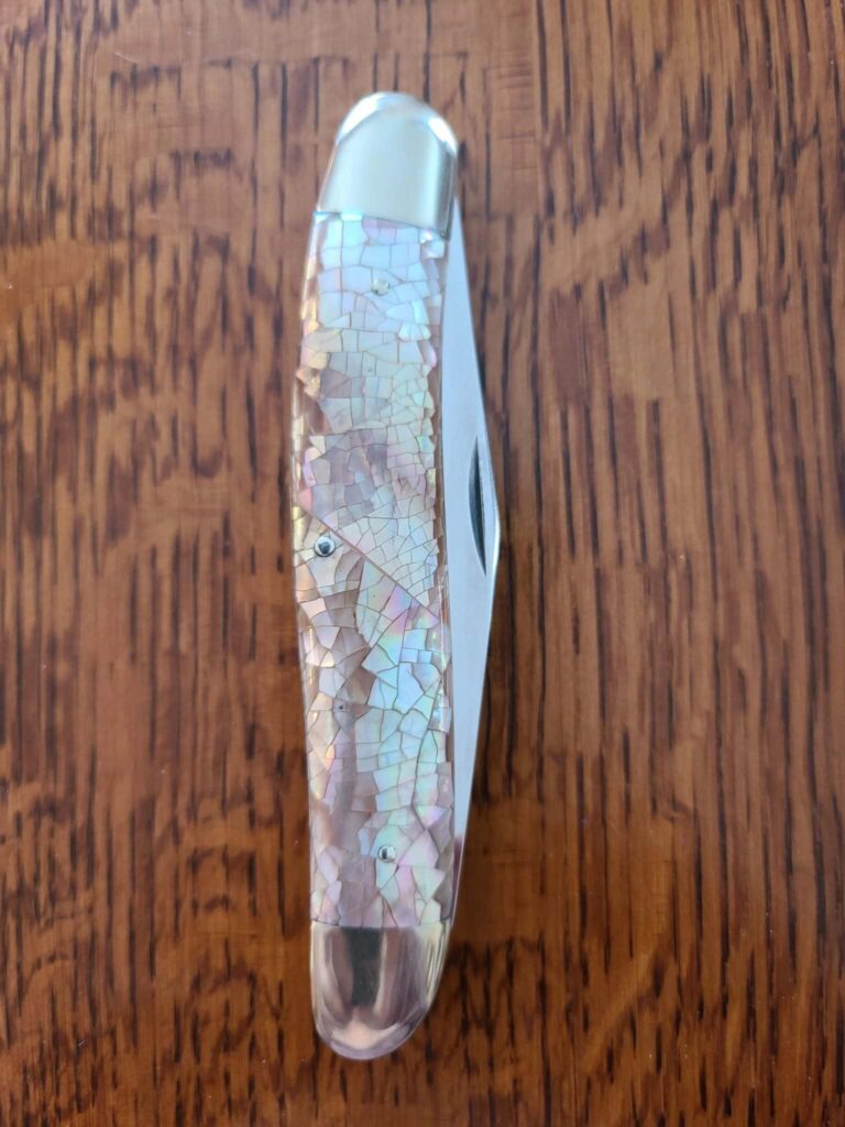 AG Russell Jumbo Muskrat Chipped Pearl knives for sale