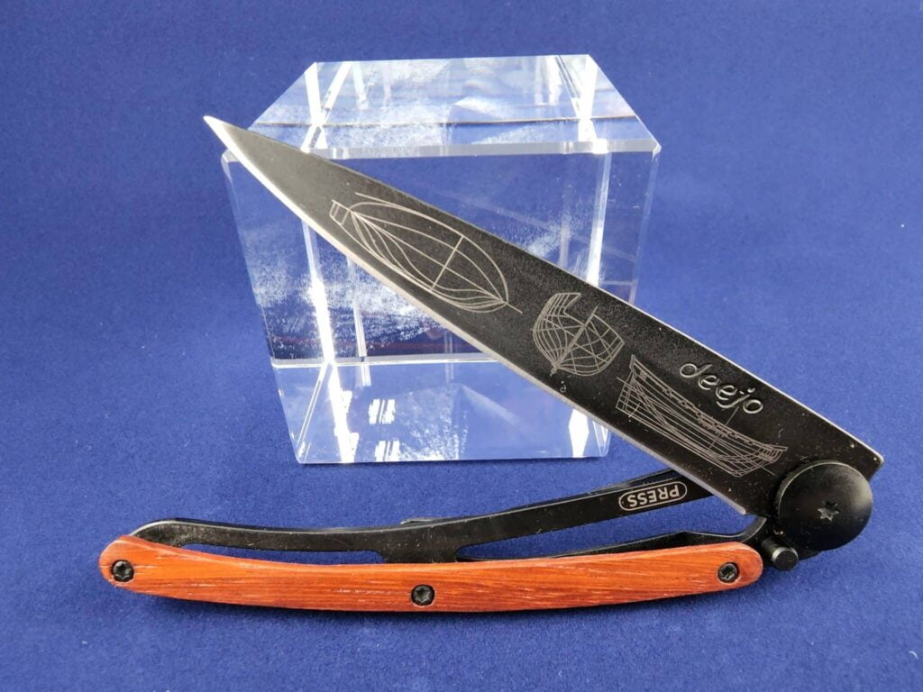 Deejo Tatoo: Ocean black titanium coated blade with Galleon tattoo and coralwood handle knives for sale