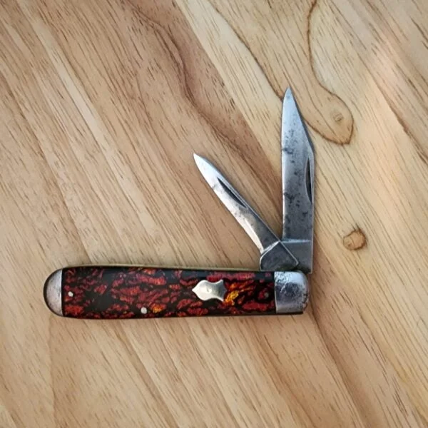 1920's Winchester #2111 with Steel Bolsters and Red Sparkle Scales. knives for sale