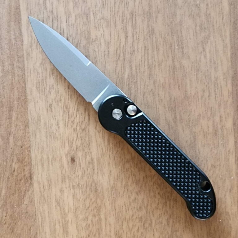 1998 Vintage French Nitrox 98 Bead Blasted Drop Point, Black Intergal with Rubberized Inserts Push Button Open By Brad West. knives for sale
