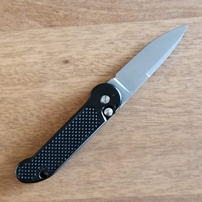 1998 Vintage French Nitrox 98 Bead Blasted Drop Point, Black Intergal with Rubberized Inserts Push Button Open By Brad West. knives for sale