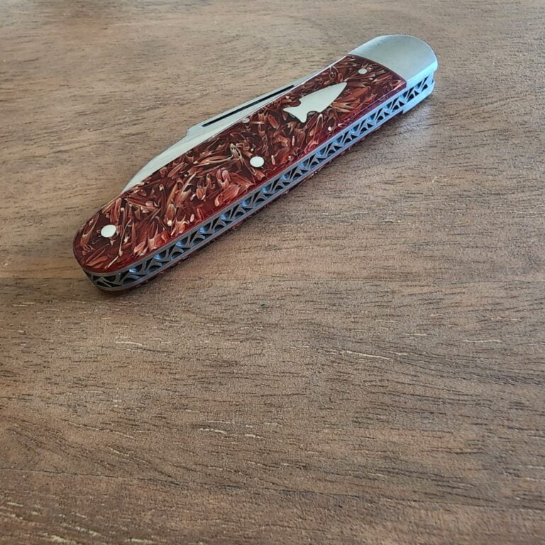 K'Roo Custom Hollow Ground Sleeveboard Wharncliffe in Red Seed Husk Resin Created April 2024 by W. O'Kelly knives for sale