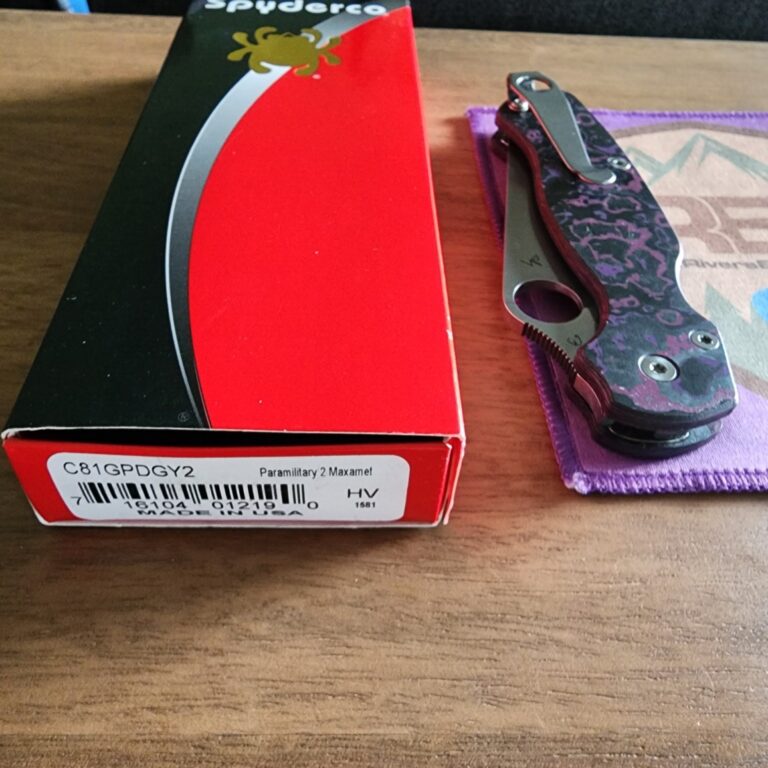 Spyderco PM2 with Maxamet blade steel, REC Exclusive Purple Haze Carbon Fiber scales with microfiber cloth, Rockscale Designs Titanium backspacer/lanyard tube, and LynchClip Titanium pocket clip. knives for sale