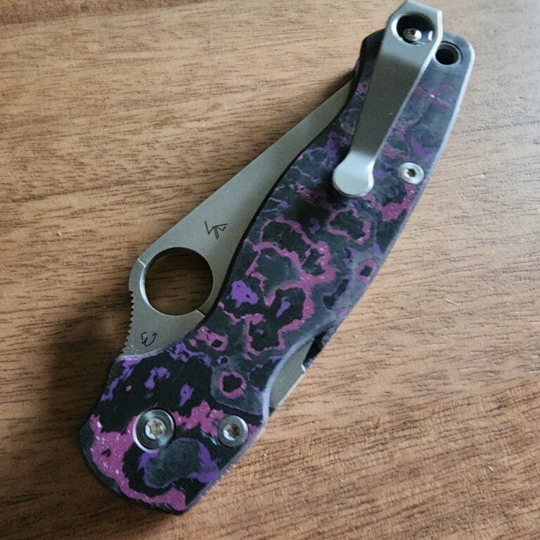 Spyderco PM2 with Maxamet blade steel, REC Exclusive Purple Haze Carbon Fiber scales with microfiber cloth, Rockscale Designs Titanium backspacer/lanyard tube, and LynchClip Titanium pocket clip. knives for sale