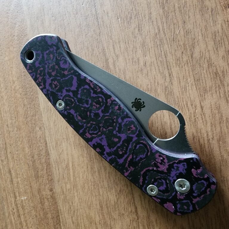 Spyderco PM2 with Maxamet blade steel, REC Exclusive Purple Haze Carbon Fiber scales with microfiber cloth, Rockscale Designs Titanium backspacer/lanyard tube, and LynchClip Titanium pocket clip. knives for sale