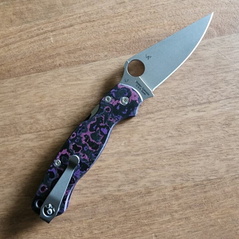 Spyderco PM2 with Maxamet blade steel, REC Exclusive Purple Haze Carbon Fiber scales with microfiber cloth, Rockscale Designs Titanium backspacer/lanyard tube, and LynchClip Titanium pocket clip. knives for sale