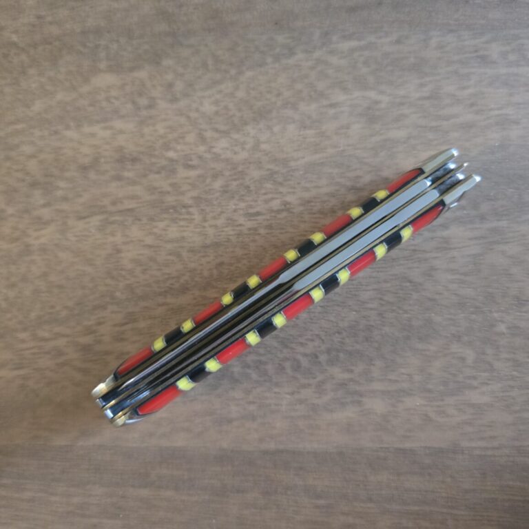 Rough Rider Trapper in Red Black and Yellow Synthetic