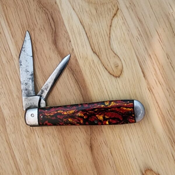 1920's Winchester #2111 with Steel Bolsters and Red Sparkle Scales. knives for sale