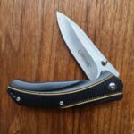 Camillus Frame Lock folder with belt clip previously owned knife for sale