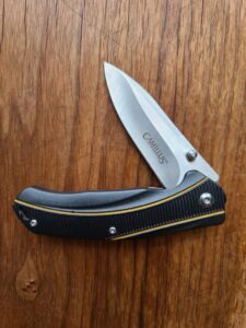 Camillus Frame Lock folder with belt clip previously owned knives for sale