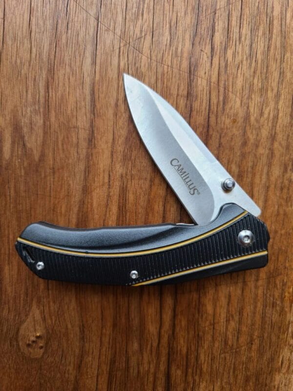 Camillus Frame Lock folder with belt clip previously owned knives for sale