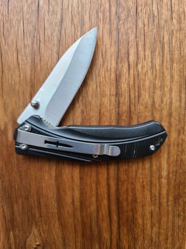 Camillus Frame Lock folder with belt clip previously owned knives for sale