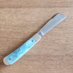 Titusville TSA Exclusive Mermaid Blue Giraffe Bone Big Easy Cotton Sampler 1095 Carbon W/ Long Pull 1 of 6 knives for sale