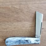 Titusville TSA Exclusive Lone Wolf Giraffe Bone Big Easy Cotton Sampler Shadow Pattern 1095 Carbon W/ Long Pull 1 of 6 knife for sale