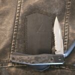 Suprlativ Infidel in Titanium Black PVD/ Black Camo Fat Carbon and M4/ Serrated Belt Satin knife for sale