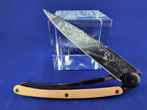 Deejo Tatoo: Earth black titanium coated blade with ski tattoo and Juniper handle