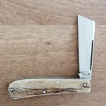 Titusville TSA Exclusive Brown Sugar Giraffe Bone Big Easy Cotton Sampler Shadow Pattern 1095 Carbon W/ Long Pull 1 of 6 knife for sale
