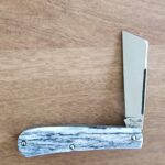 Titusville TSA Exclusive Lone Wolf Giraffe Bone Big Easy Cotton Sampler Shadow Pattern 1095 Carbon W/ Long Pull 1 of 6 knife for sale