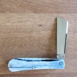 Titusville TSA Exclusive Olympic Blue Giraffe Bone Big Easy Cotton Sampler Shadow Pattern 1095 Carbon W/ Long Pull 1 of 6 knife for sale