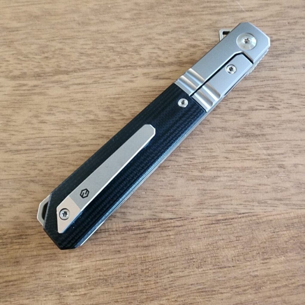 Karbon Knives By Ken Onion Flatline Frame Lock in 154CM Stainless and Black G10 knife for sale
