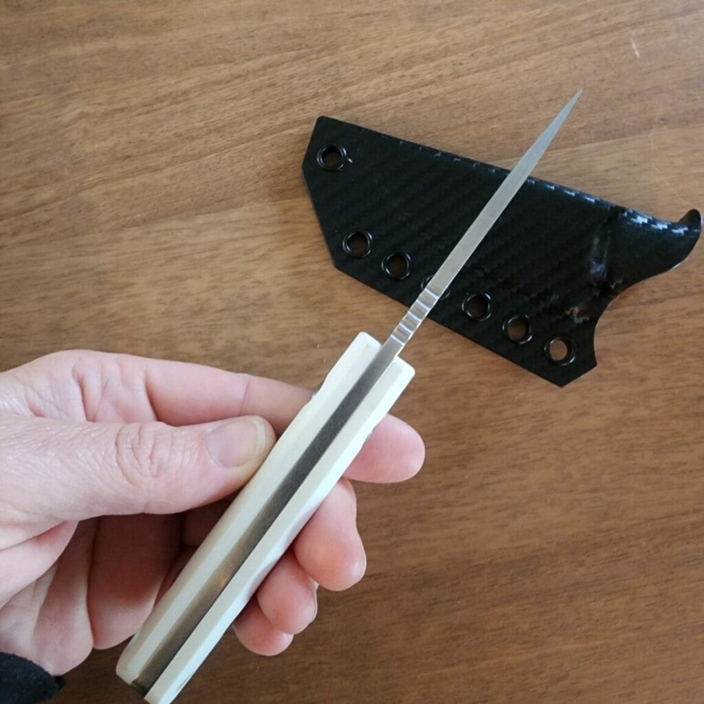 Twisted Assisted Gambler in S35VN w/ 2 sets of g10 handles (white & black) & Custom Armatus Carry Solutions Sheath in carbon fiber style kydex knife for sale