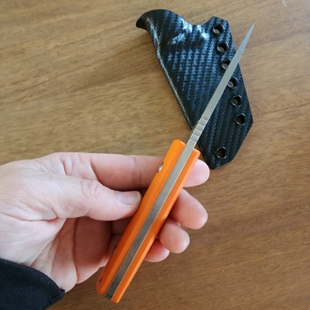Twisted Assisted Gambler in 14C28N w/ 2 sets of g10 handles (OD green & orange) & Custom Armatus Carry Solutions Sheath in carbon fiber style kydex – gallery image 4