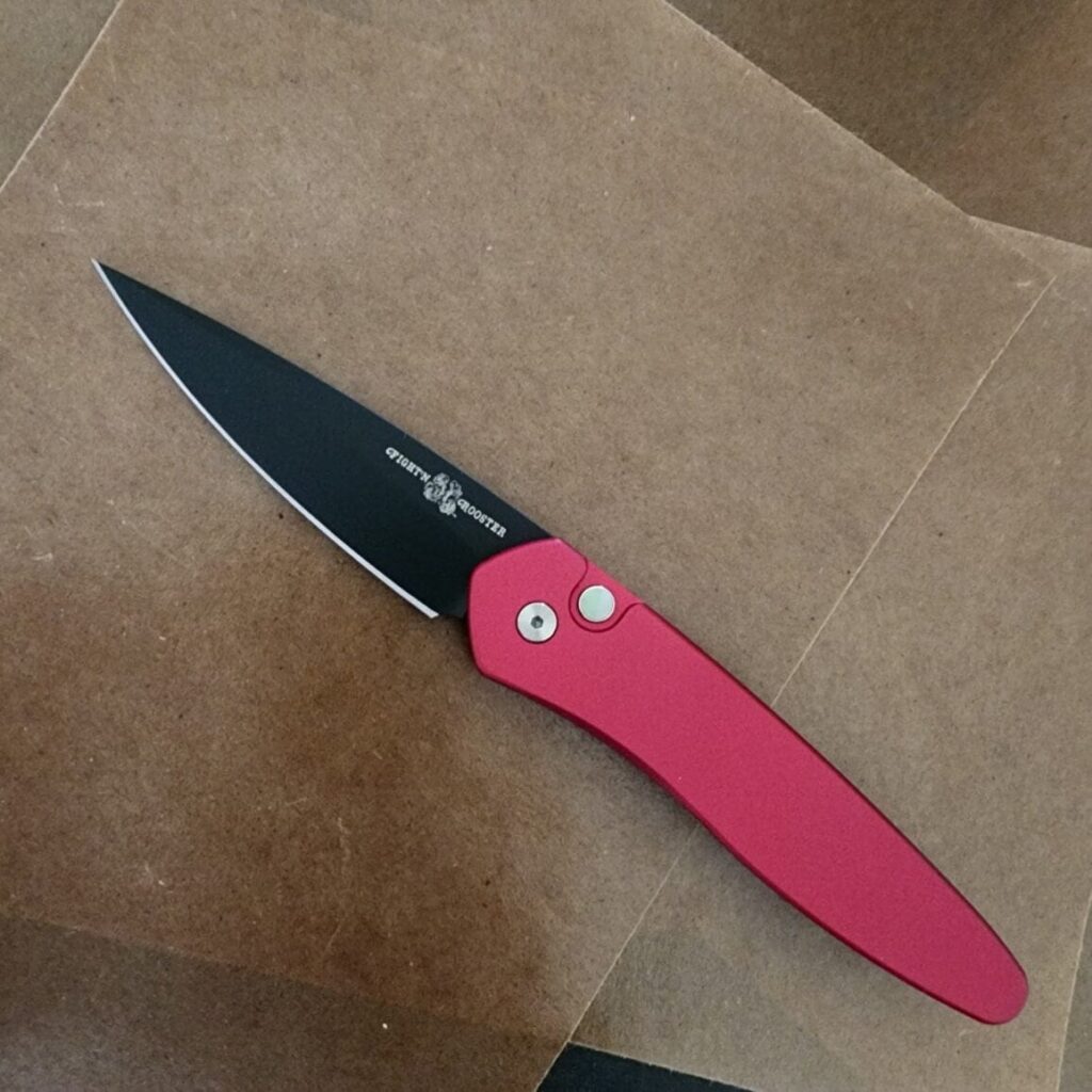 Protech Fight'n Rooster Newport with Solid Red Handle, Black DLC Blade, Black Lip Pearl Button and Black Clip #7 of 100 – gallery image 7