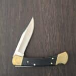 Buck USA110 in Ebony with Leather Sheath (patina from storage in sheath) knife for sale