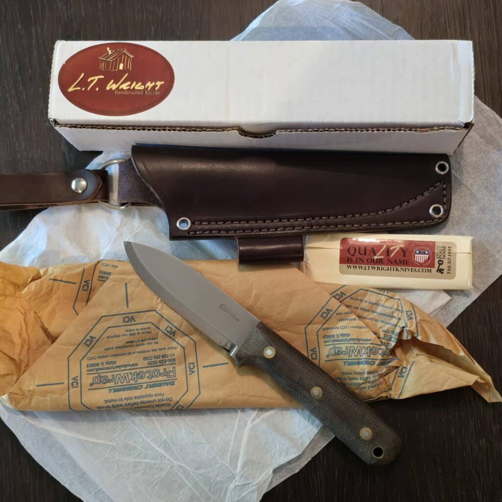 L.T. Wright Handcrafted Knives fixed blade knife in Canvas Micarta and A2 drop point blade 10¼" OAL full tang with the lined lanyard hole and brown leather sheath with a belt loop – gallery image 6