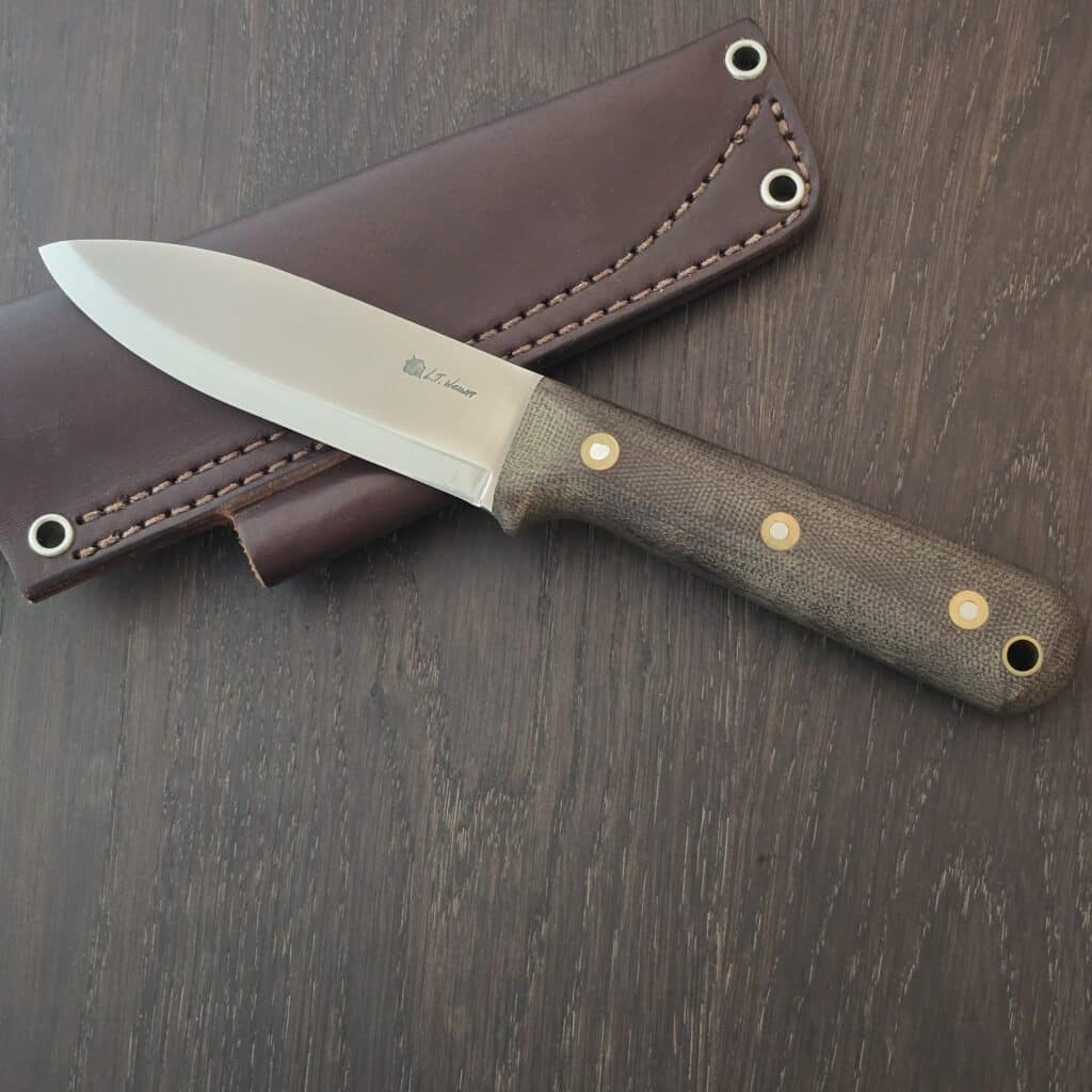 L.T. Wright Handcrafted Knives fixed blade knife in Canvas Micarta and A2 drop point blade 10¼" OAL full tang with the lined lanyard hole and brown leather sheath with a belt loop – gallery image 4