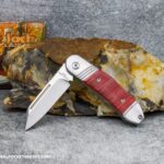 C. Risner Sugar Maple Jack: Red Sawcut Bone - Modified Sheepsfoot 154CM