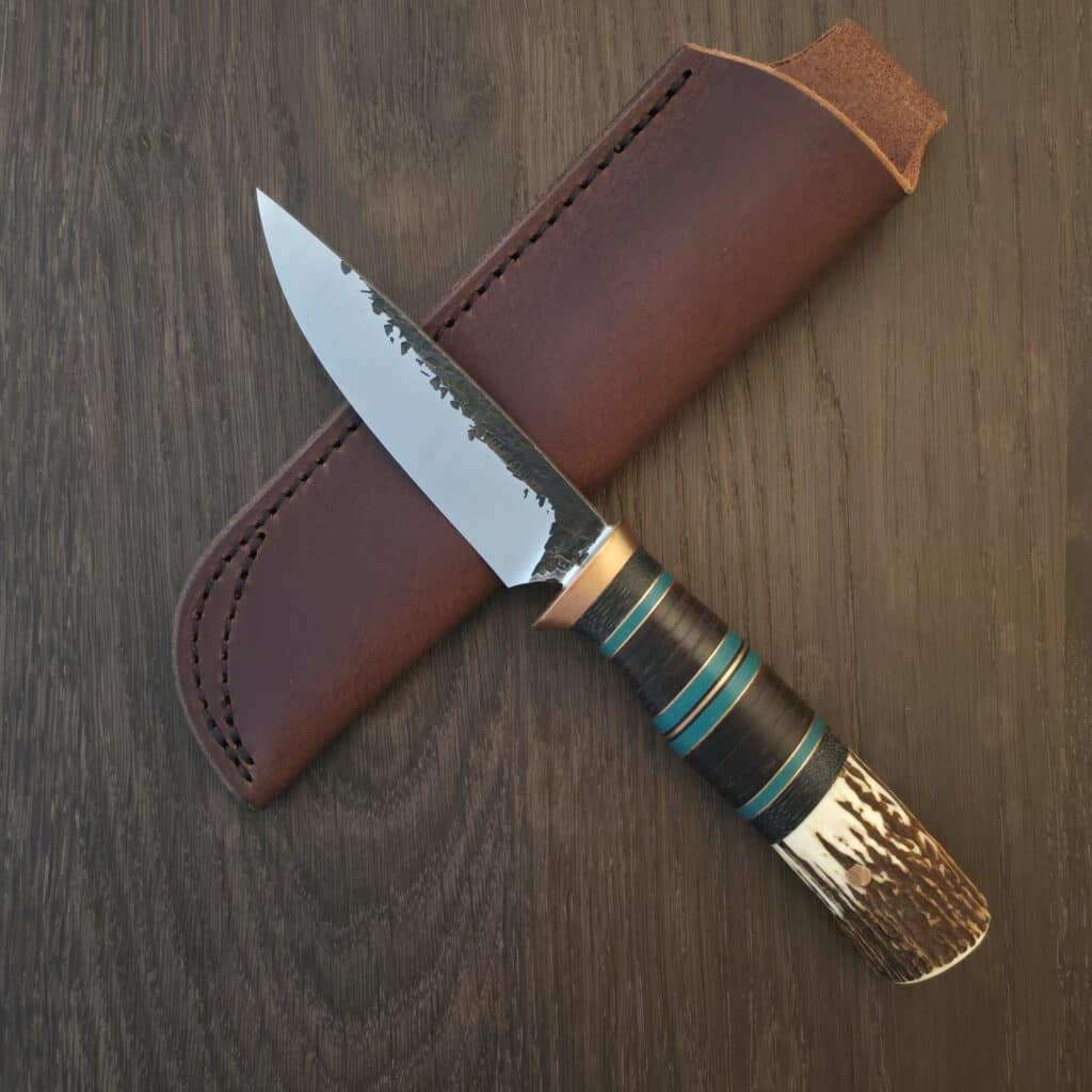 Warlander Knives T & B in 80Crv2 and Copper, Sambar Stag, Black Canvas Hores Hide and Teal Fiber 11/2024 knife for sale