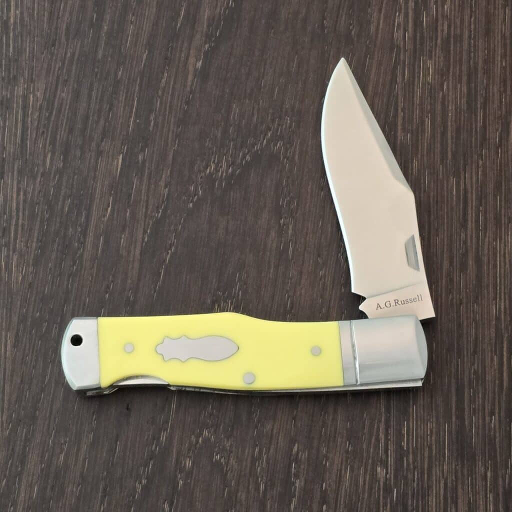 A.G. Russell Gunstock Lock back in Yellow Delrin 8CR13 MOV (please note stabilized crack at pin) – gallery image 4