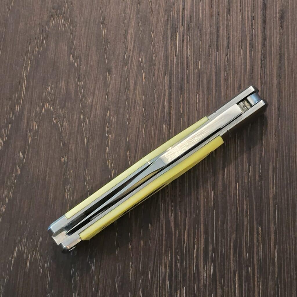 A.G. Russell Gunstock Lock back in Yellow Delrin 8CR13 MOV (please note stabilized crack at pin) – gallery image 2