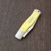 A.G. Russell Gunstock Lock back in Yellow Delrin 8CR13 MOV (please note stabilized crack at pin) knife for sale