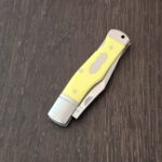 A.G. Russell Gunstock Lock back in Yellow Delrin 8CR13 MOV (please note stabilized crack at pin) knife for sale