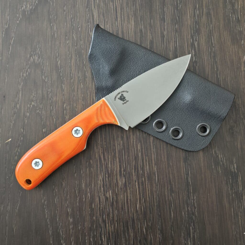 Unbound Knives/ Nikola Rusev Modified Cargo Model in Elmax 62 HRC Cryo and Orange Micarta Scales with White G10 Liners and White Gulso Hardware knife for sale