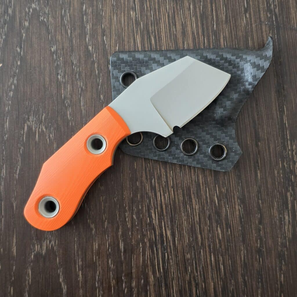 Sakman Steenkamp Custom EDC in N690 and Orange G10 with Faired Stainless Tubes and Custom Carbon Fiber Kydex Sheath By Armatus knife for sale