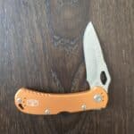 Buck USA 722 in Orange Aluminum and 420HC Spitfire Lockback 7453 knife for sale