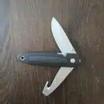 Buck USA model 180 cross lock stainless drop point main blade and gut hook/cord cutter secondary blade both blades lock using a liner lock (USED) knife for sale