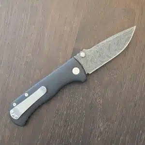 Defiant-7 Talos Button Lock with Black Boomerang Stainless Chad Nichols Damascus Blade and Black Hardcoat Anodized Aluminum Handles USA knife for sale