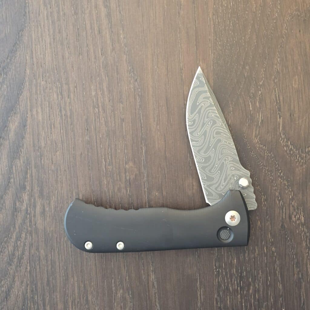 Defiant-7 Talos Button Lock with Black Boomerang Stainless Chad Nichols Damascus Blade and Black Hardcoat Anodized Aluminum Handles USA knife for sale