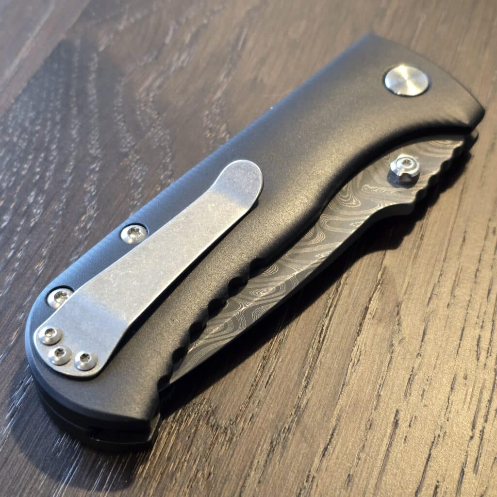 Defiant-7 Talos Button Lock with Black Boomerang Stainless Chad Nichols Damascus Blade and Black Hardcoat Anodized Aluminum Handles USA knife for sale