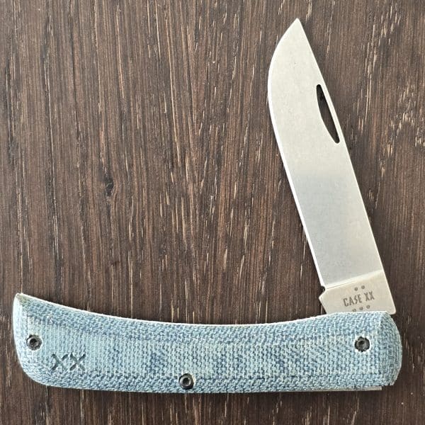 Case XX USA 2025 Blue Denim Canvas XR Crossroads S35VN Sod Buster Jr XR10137 in S35VNBlue Denim Canas Laminate / White G-10 handles – gallery image 1