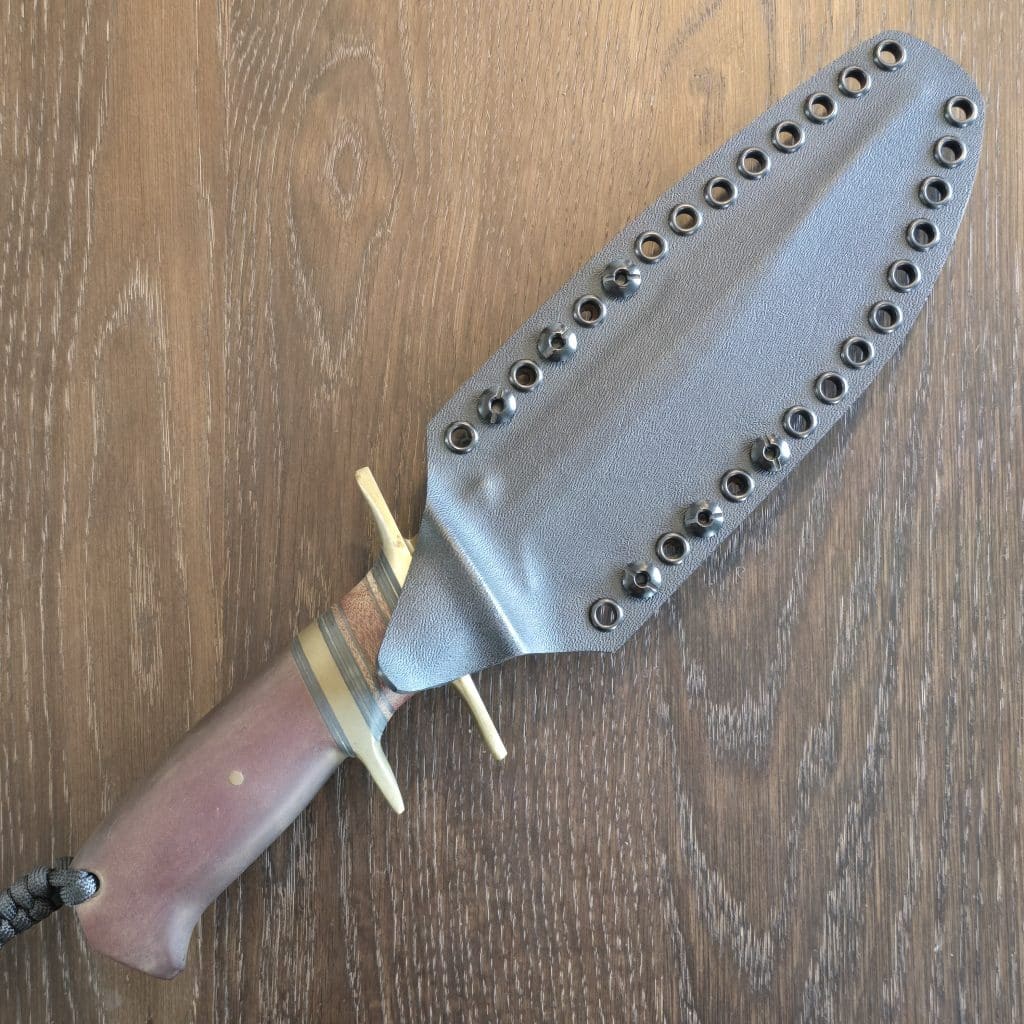 Behring Technical "Lightning" in O1 tool steel with green Cerakote finish Brass hilts with natural micarta, brass, and black spacers Paper micarta handle Thong hole with braided lanyard Kydex sheath with Tek-Lok style clip Marked 03-14, 016 - Image 3