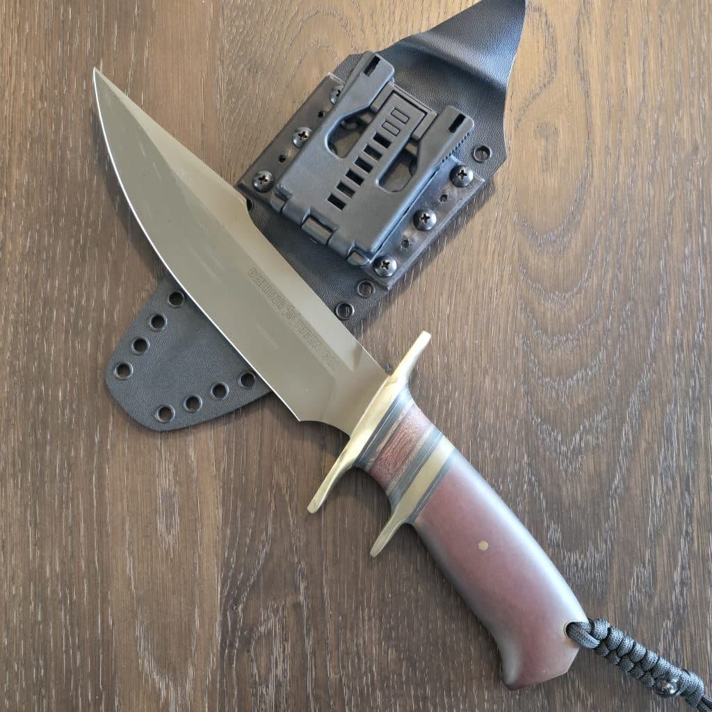 Behring Technical "Lightning" in O1 tool steel with green Cerakote finish Brass hilts with natural micarta, brass, and black spacers Paper micarta handle Thong hole with braided lanyard Kydex sheath with Tek-Lok style clip Marked 03-14, 016 - Image 2