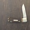 Vintage Old Timer by Schrade model 30 T lockback. 2-1/8/" stainless steel drop point blade Brown sawcut Delrin handles. Nickel bolsters. Brass dividers