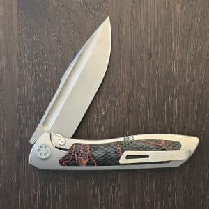 Sharp By Design Typhoon 10 in M390 and Titanium with Textured Lava Flow Kirinite Inlay